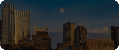 Evening skyline of Fort Worth with warm lighting and high-rise buildings