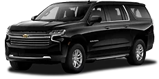Two black luxury SUVS (Chevrolet Suburban and Cadillac Escalade)